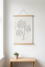 Affiche feuille de monstera suspendue avec le porte-affiche Tasseaux en hêtre